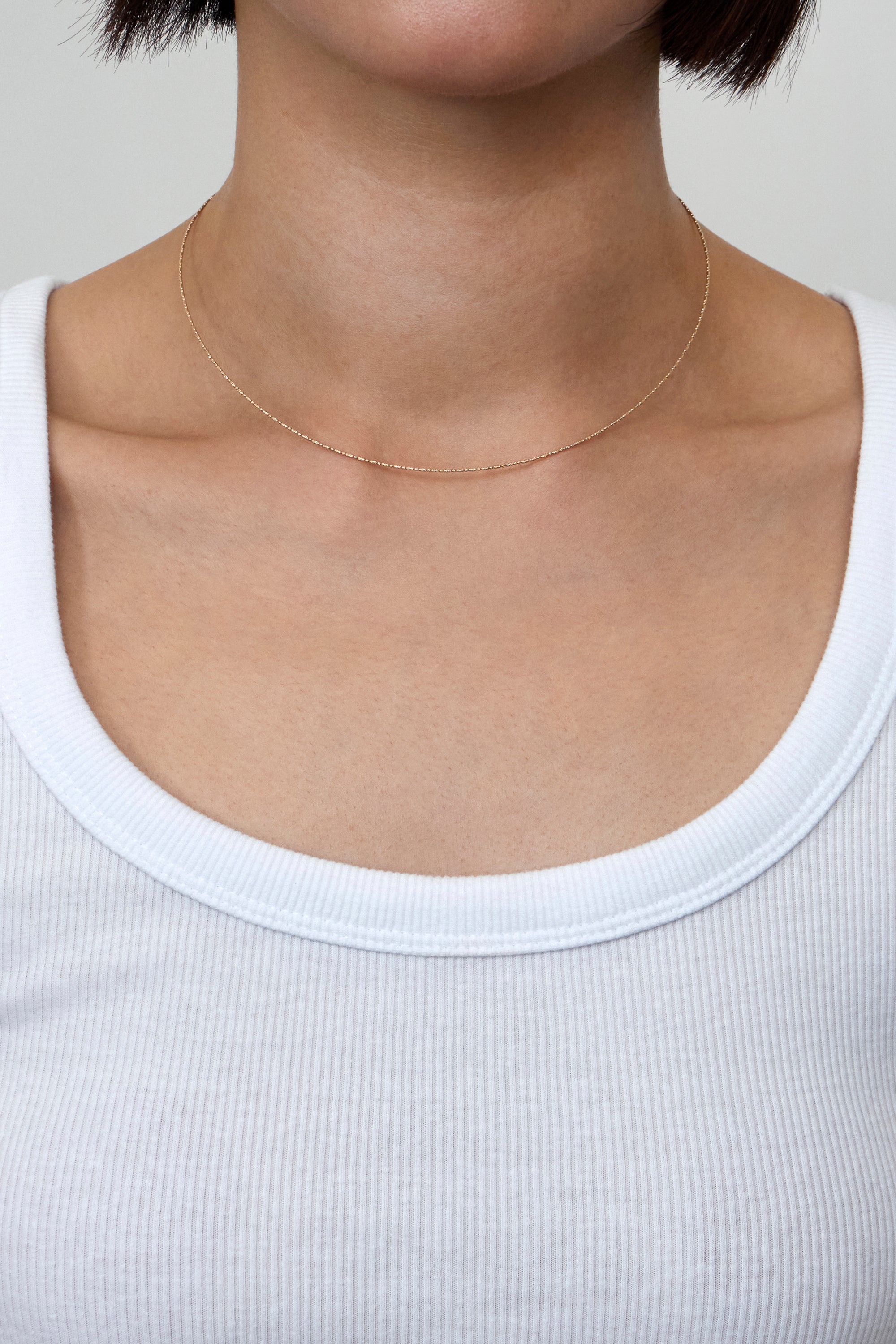 TITANIUM CORE OVAL LINK NECKLACE IN GOLD