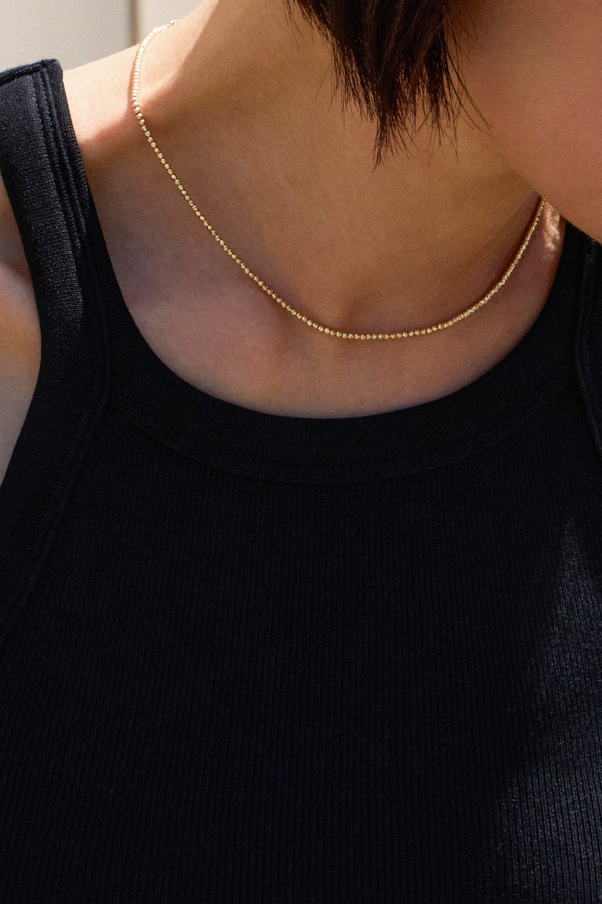 FACETED BALL CHAIN NECKLACE IN GOLD